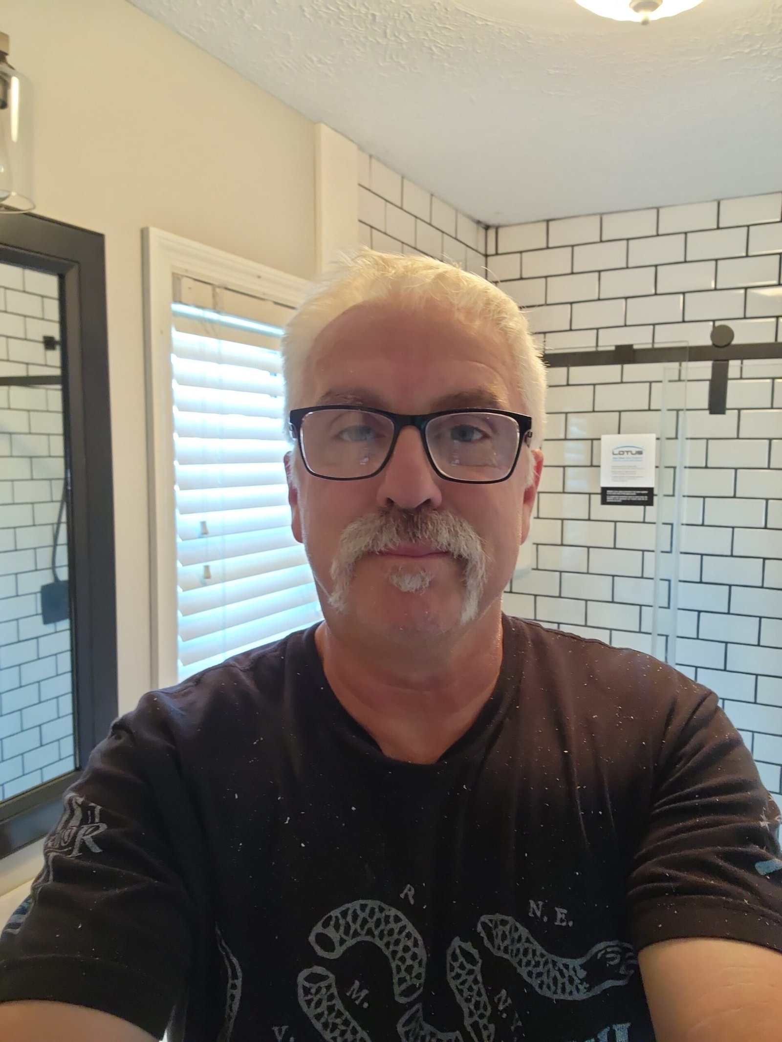 Mike Warner of EazyStep Bath in a completed bathroom project