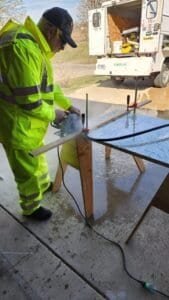 Worker shown during fabrication and installation work