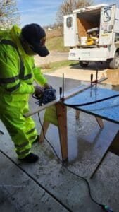 Worker shown during fabrication and installation work