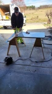 Worker shown during fabrication and installation work