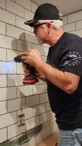 Worker shown during kitchen remodeling